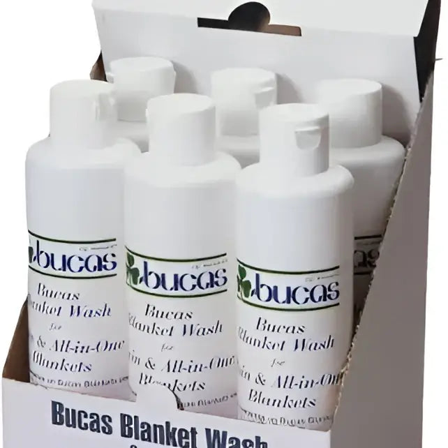 White plastic bottles of bucas rug wash for wool and all-in-one blankets designed for effective rug wash use