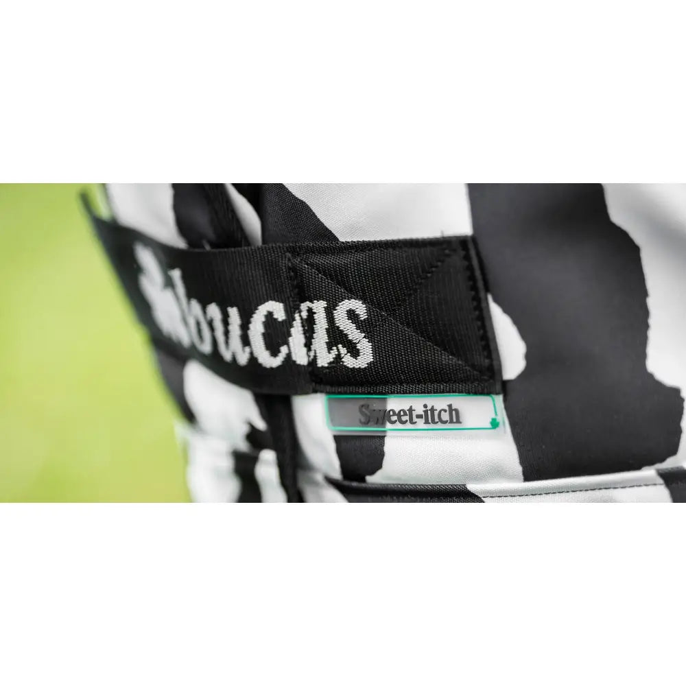 Black and white cow print snowboard boot with sweet itch green strap for bucas sweet itch itch zebra fly shoulder darts
