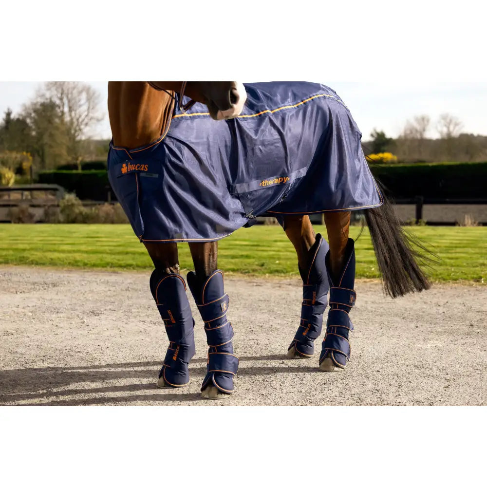 Navy blue bucas therapy travel boots with gold trim ripstop outer and matching leg wraps branded lucas therapy