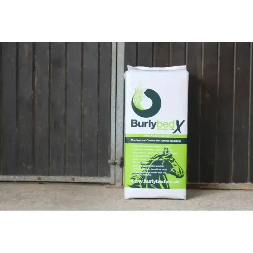 White and lime green burlybed original bag with black horse logo containing miscanthus bedding from environmentally beneficial crop