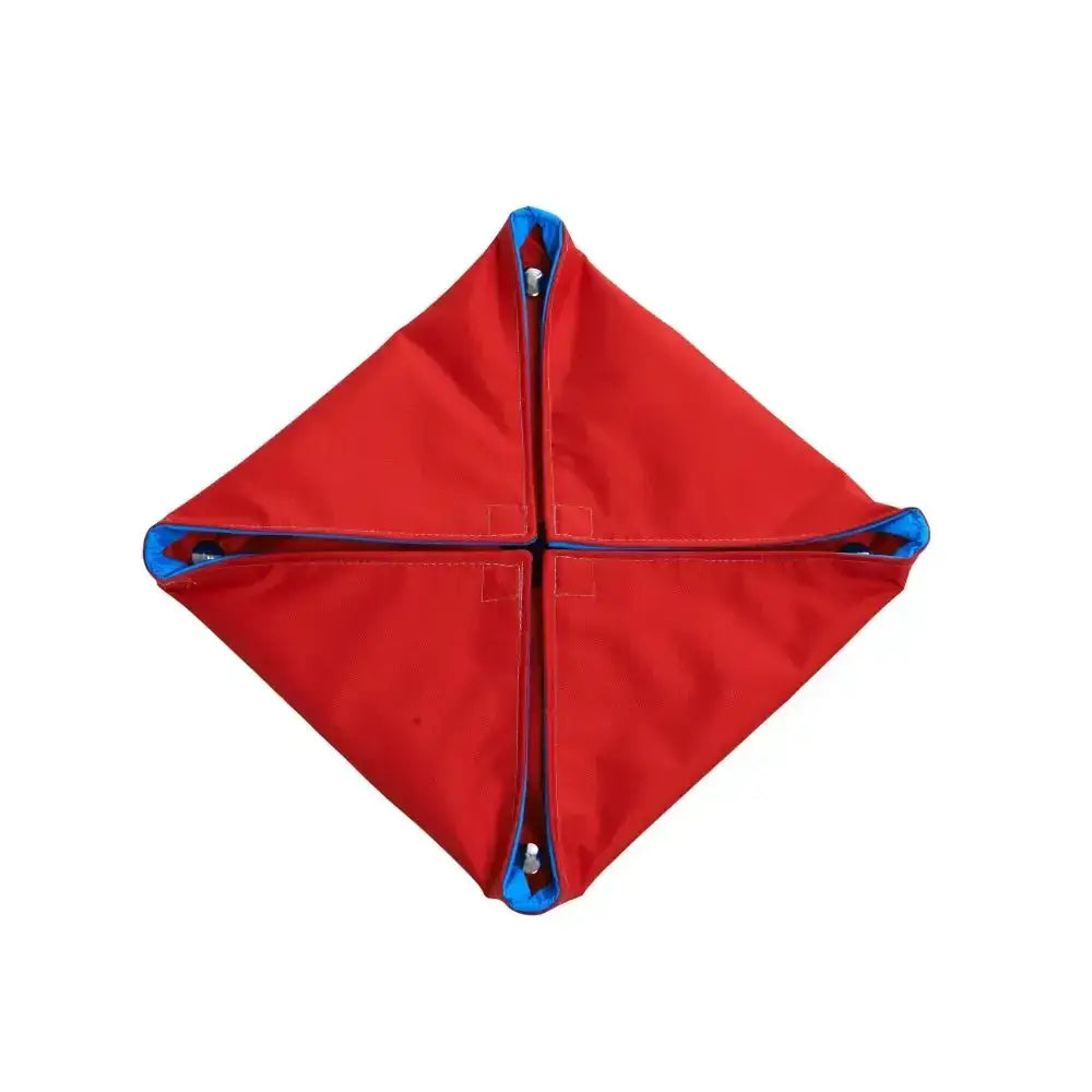 Red diamond-shaped fabric weight with blue trim and metal grommets for buster activity mat game water lilly level 1
