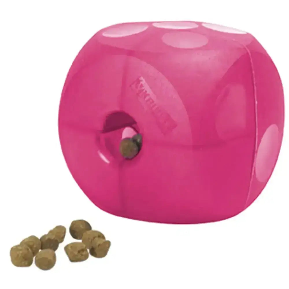 Pink buster soft cube dog toy shaped like dice with white dots and a hole for treats dispensing