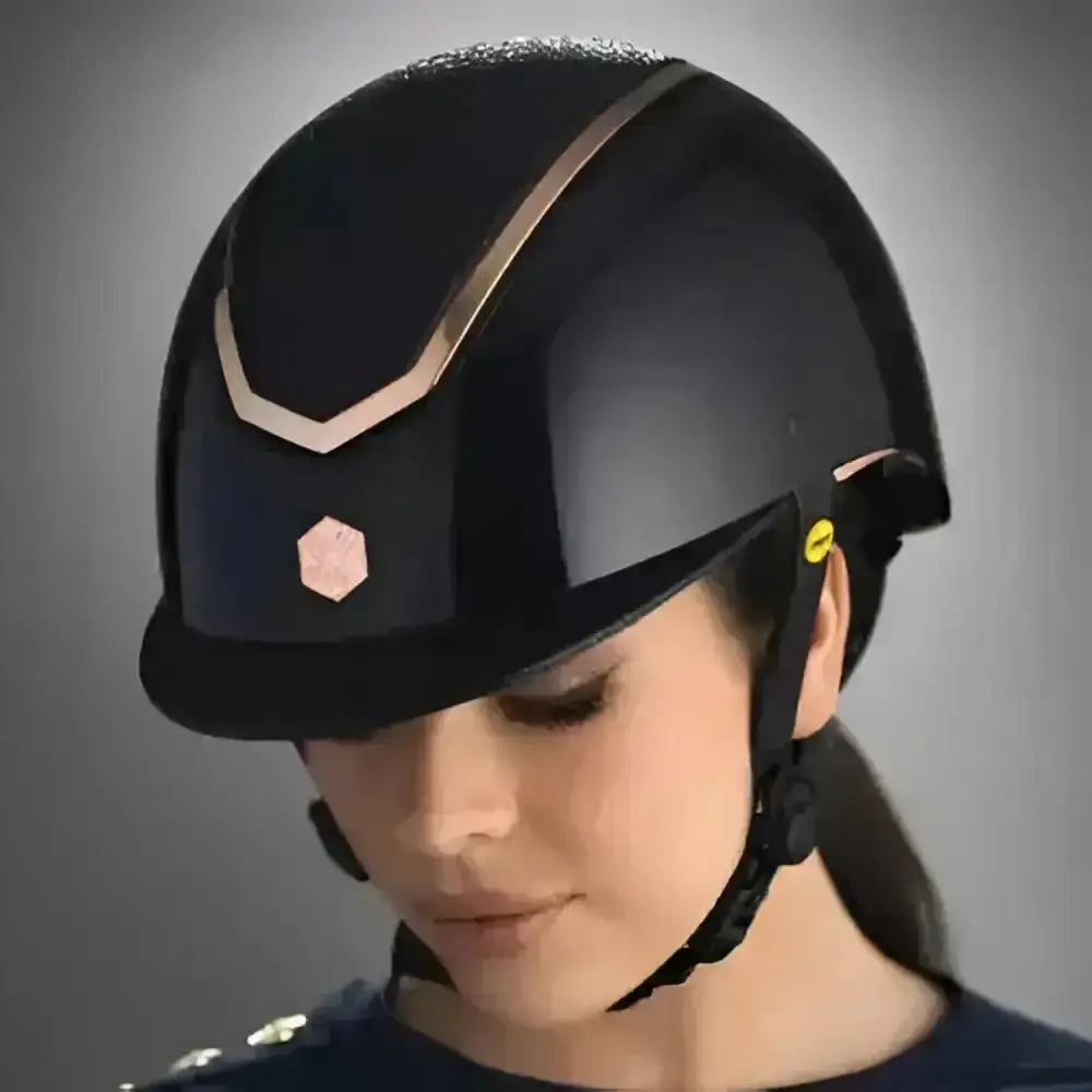 Black charles owen eqx kylo sparkly riding helmet with glossy finish and gold tone trim along the top edge