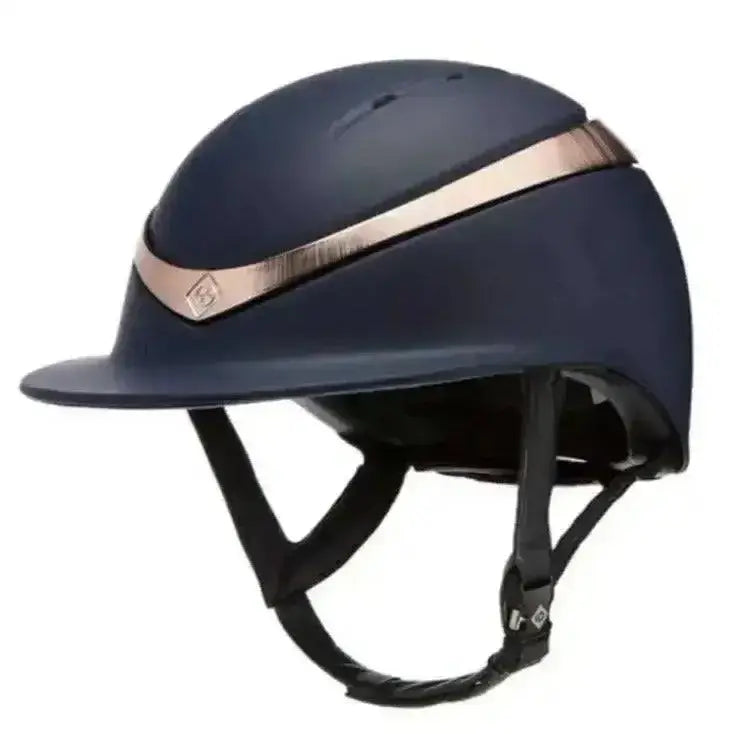 Navy blue charles owen halo matt equestrian helmet with rose gold stripe and black adjustable straps wide peak