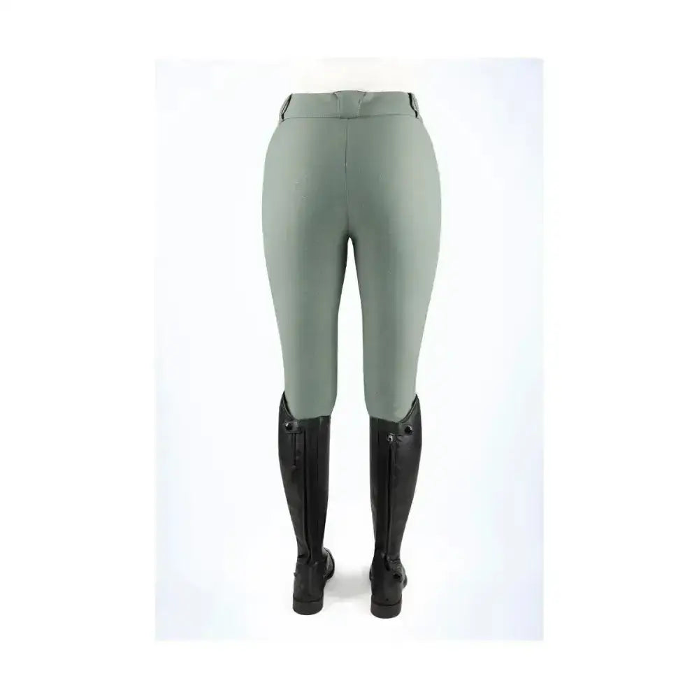 A pair of coldstream balmore thermal riding tights in sage green with brushed fleece fabric and black outer seam zippers