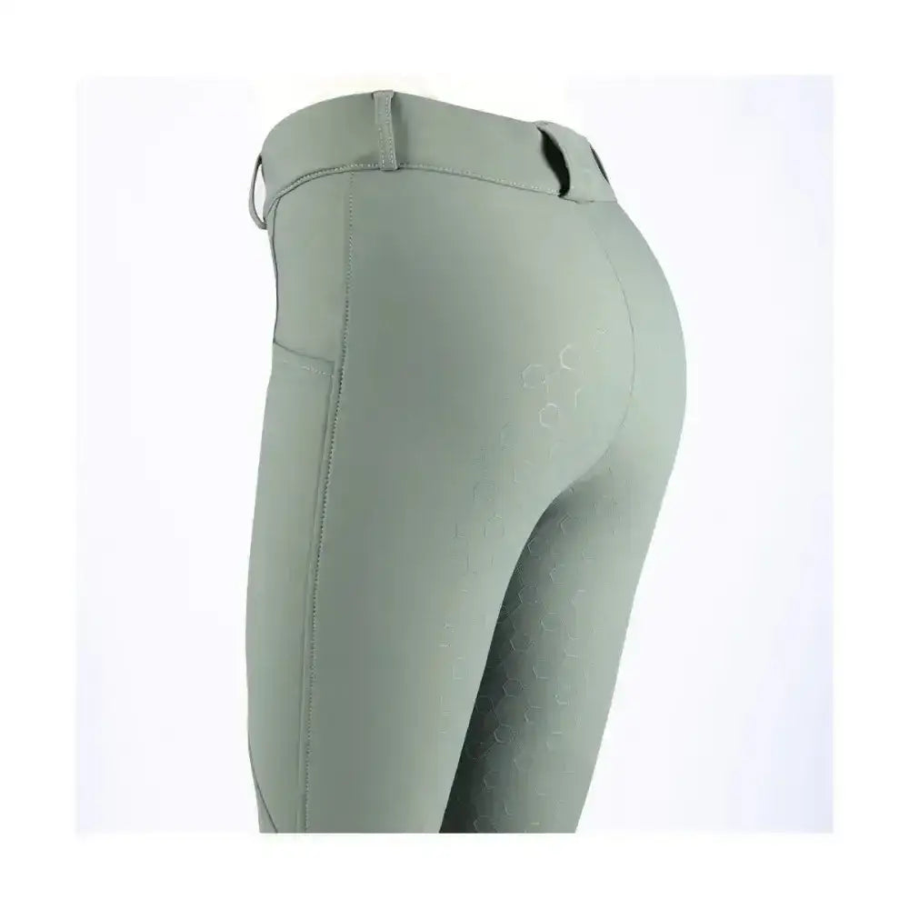 A pair of coldstream balmore thermal riding tights in sage green with brushed fleece and subtle hex texture on thighs