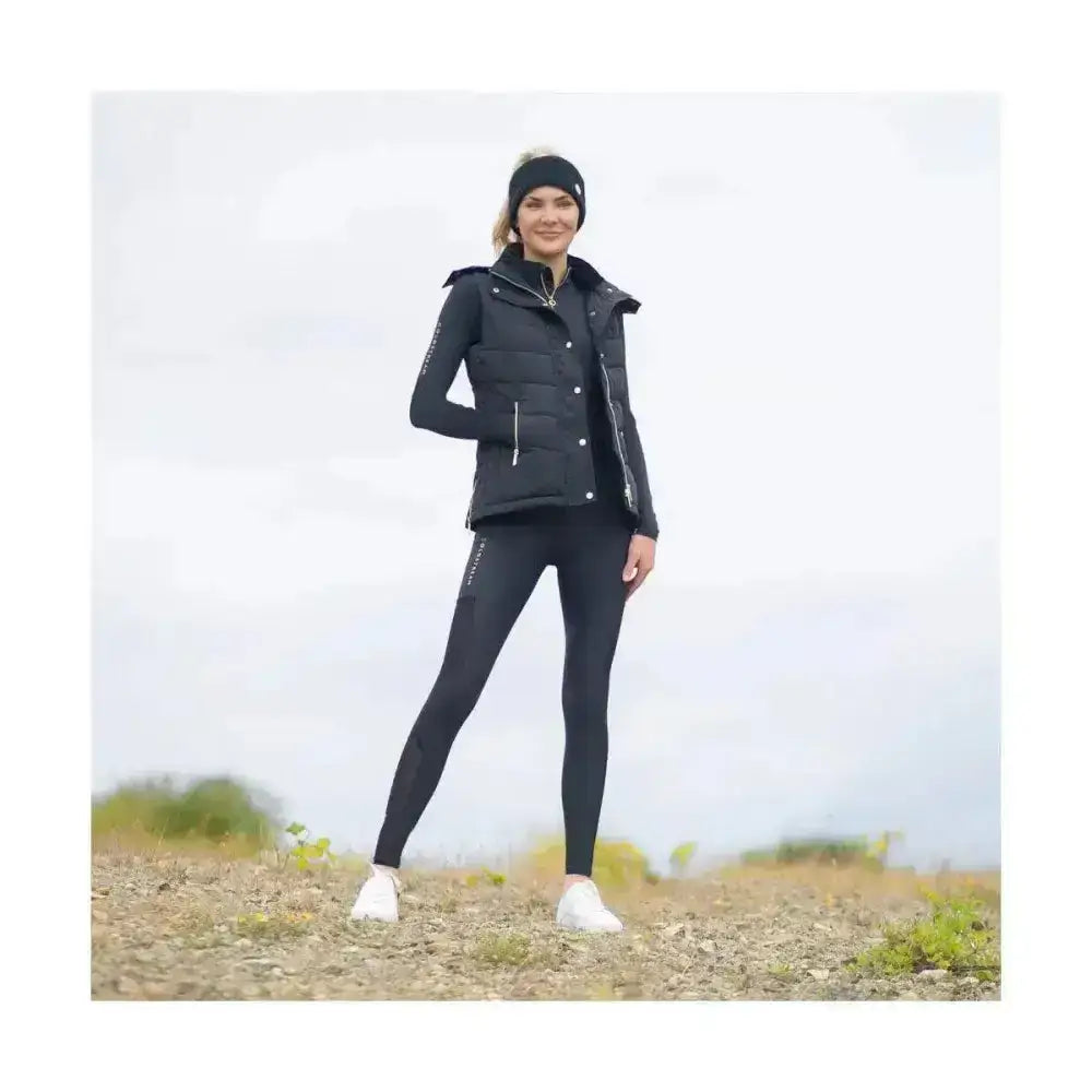 Black quilted puffer vest with zipper details and long sleeves paired with coldstream ednam riding tights using capillary action fabrics