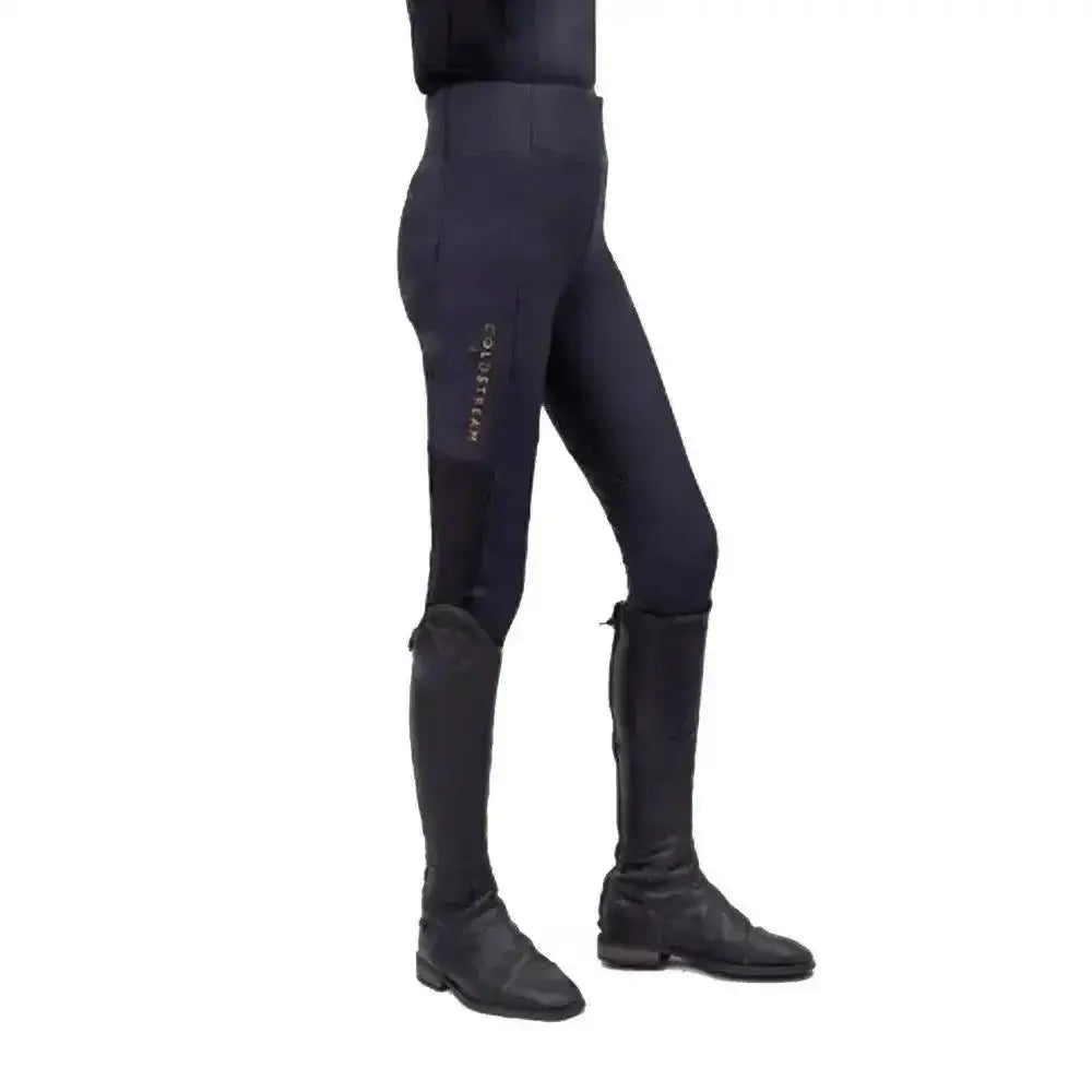 Black coldstream next generation ednam riding tights with sleek fit and subtle gold lettering using technical capillary action