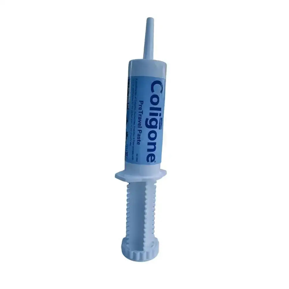 Light blue plastic syringe-style tube of coligone pretravel paste featuring built-in digestive soother for ultimate competitive edge