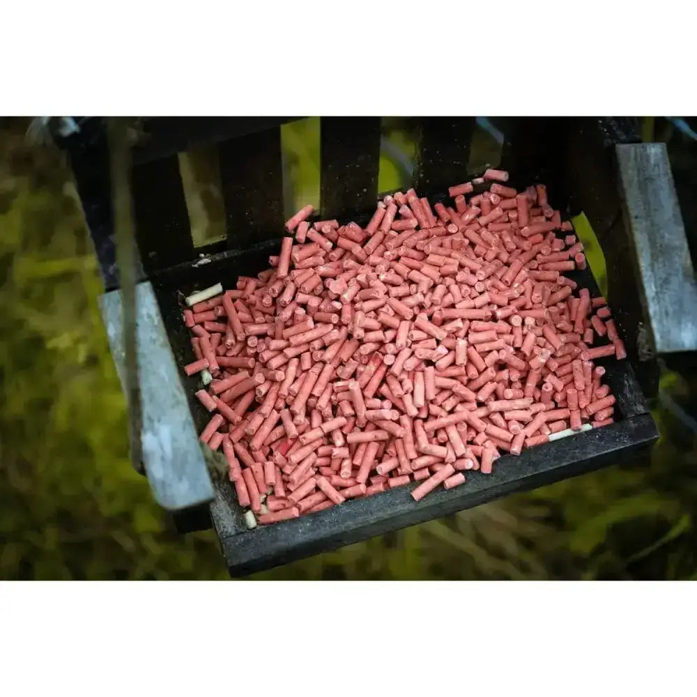 A tray filled with pink suet pellets berry from copdock mill berry tub 3kg for bird feeding