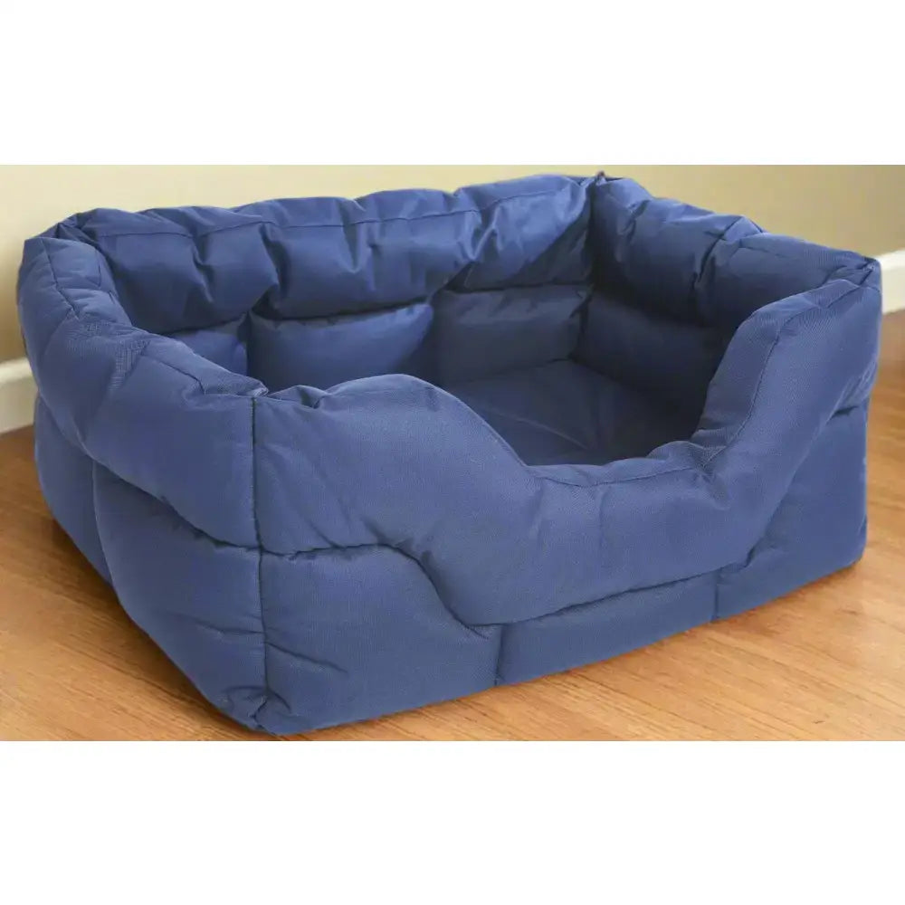 Blue quilted heavy duty rectangular dog bed with plush padded sections and high sided waterproof design