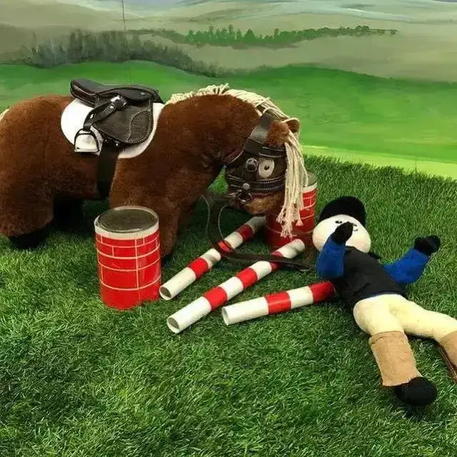 Brown plush crafty ponies body protector horse with black saddle and bridle lying on green grass shows ponies body protector helps