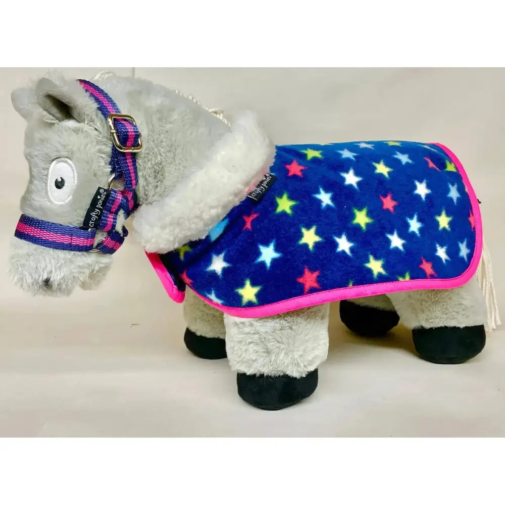 A plush gray donkey wearing a crafty ponies fleece neck show rug set in vibrant blue with pink trim and matching bridle