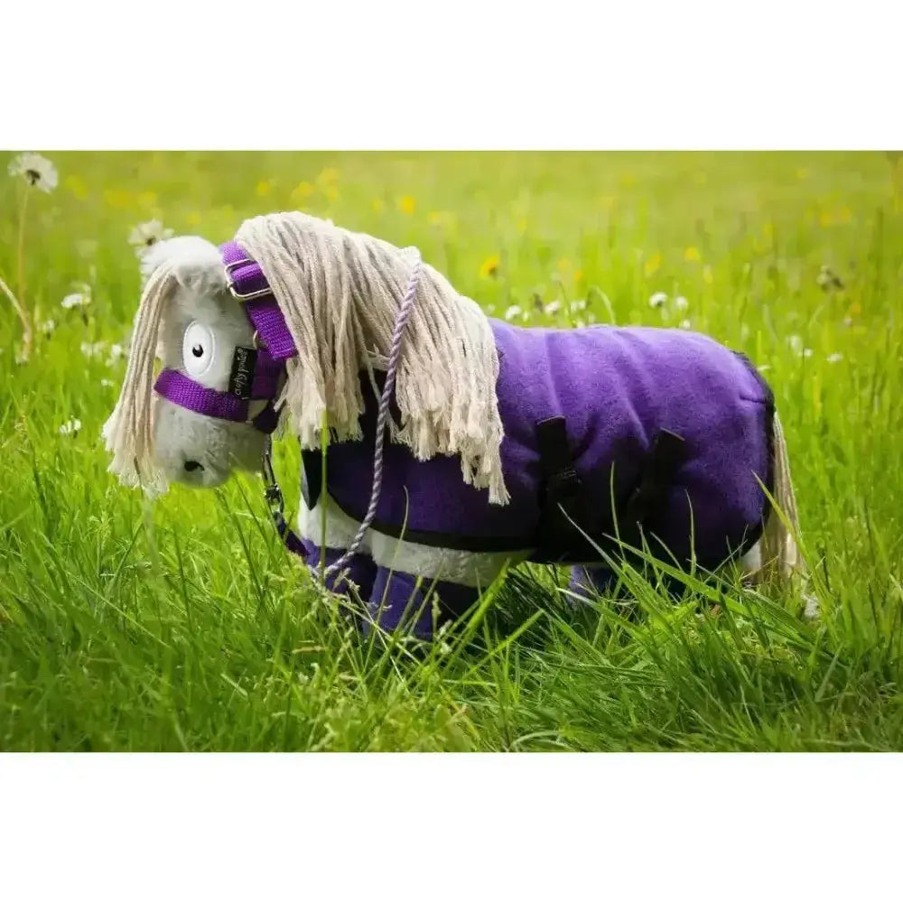 Purple plush horse toy with white mane wearing a soft velour crafty ponies fleece blanket rug set