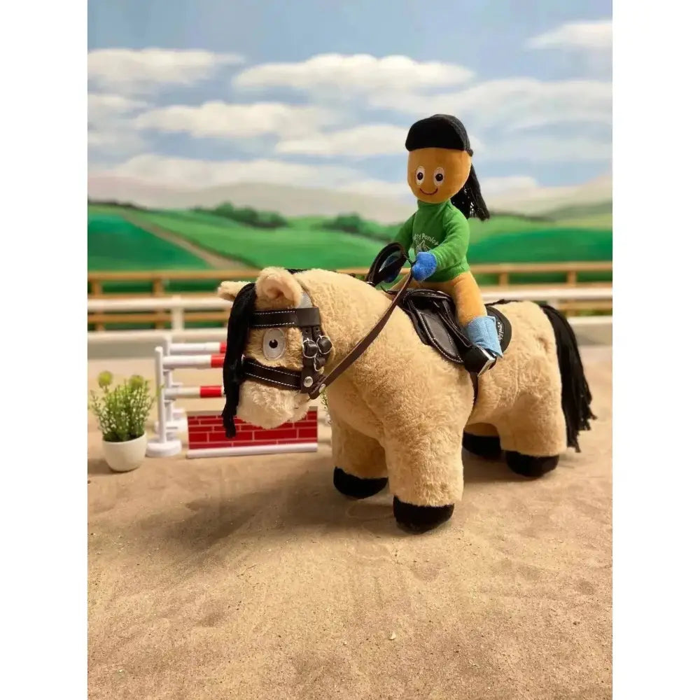 Plush crafty ponies toy pony exmoor with tan fur black mane saddle and small rider in green outfit soft toy ponies