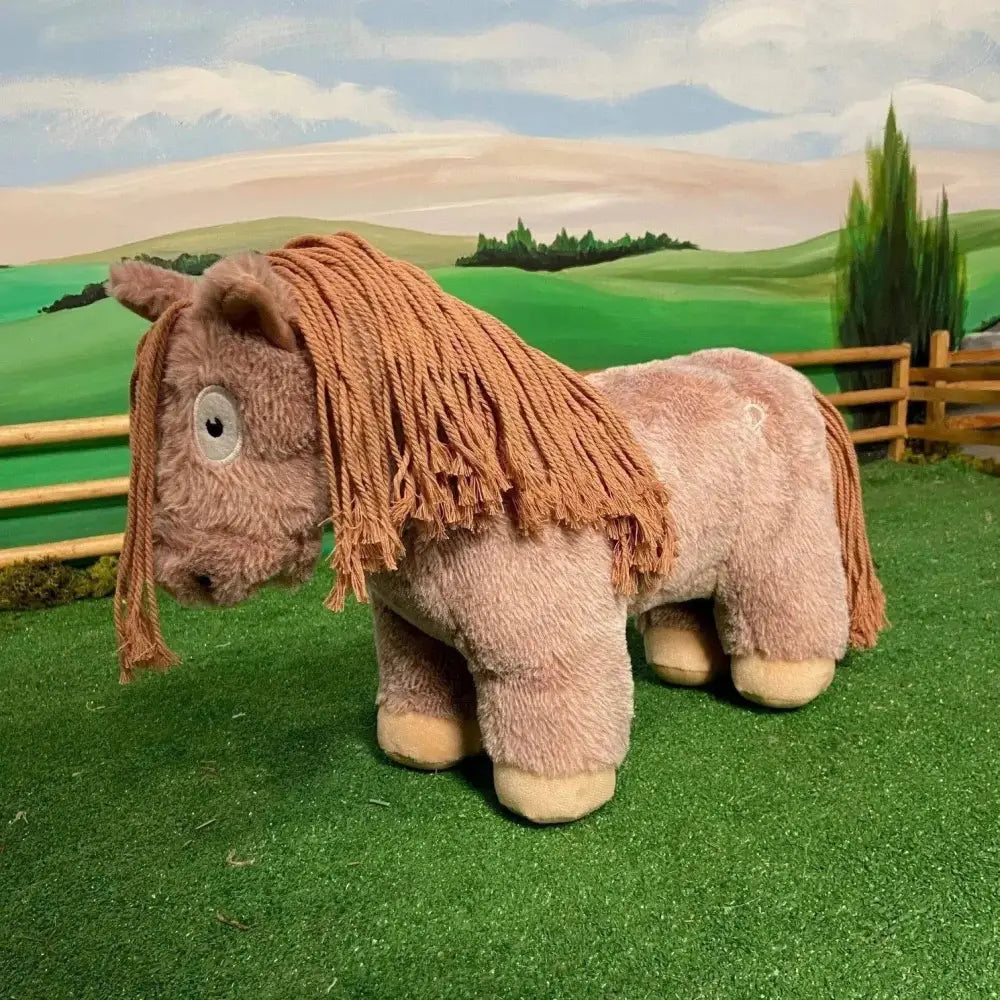 A plush crafty ponies soft toy pony roan with light brown fur and a textured mane perfect for cuddling