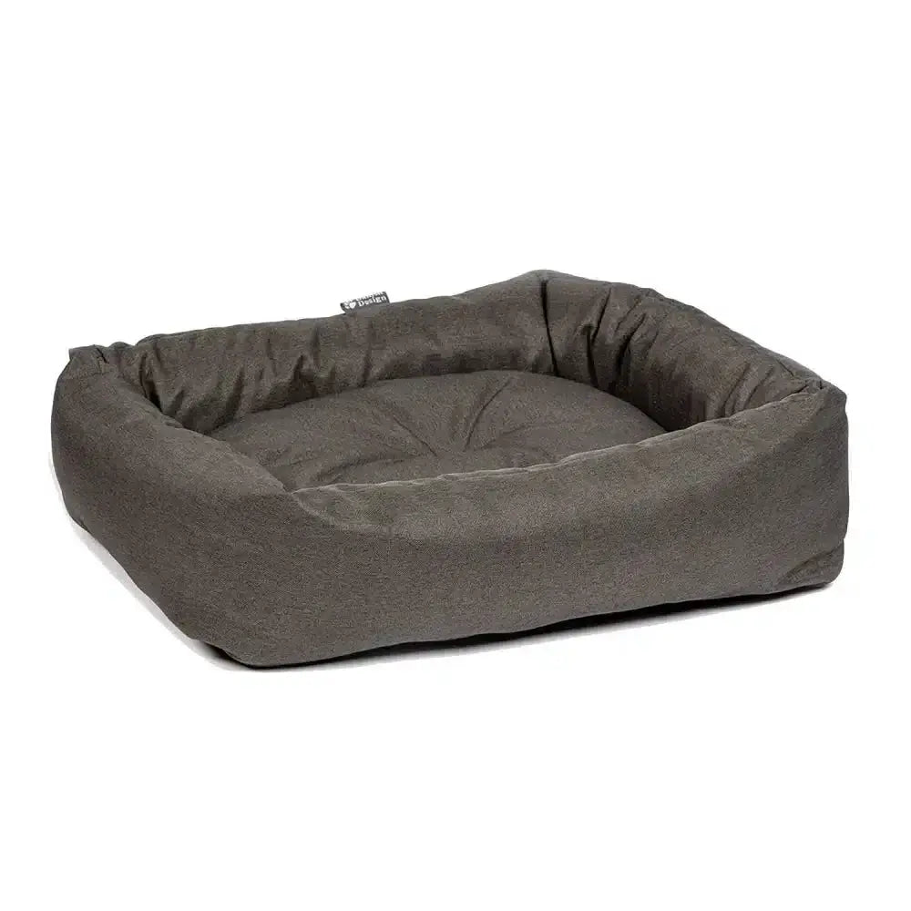 A plush danish design anti-bac snuggle bed green with olive fabric and cushioned raised sides for comfy dogs