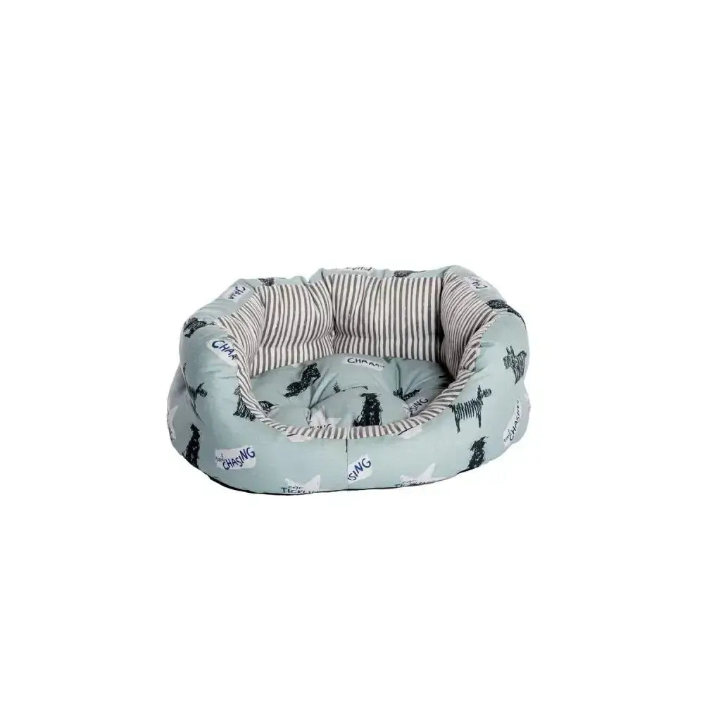 A cozy light blue danish design battersea dogs bed deluxe with playful black and white zebra print exterior and striped lining