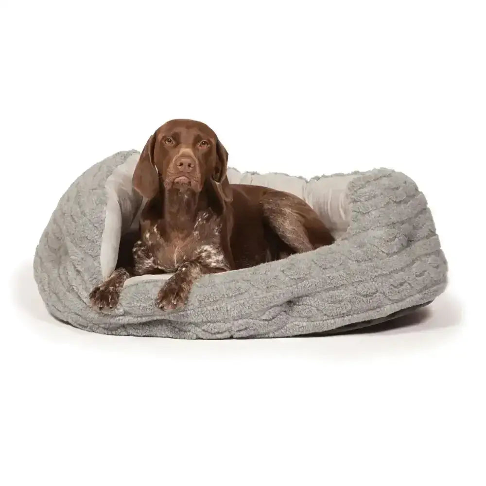 Gray knitted dog bed with soft white lining from danish design bobble deluxe slumber bed collection for cozy pets