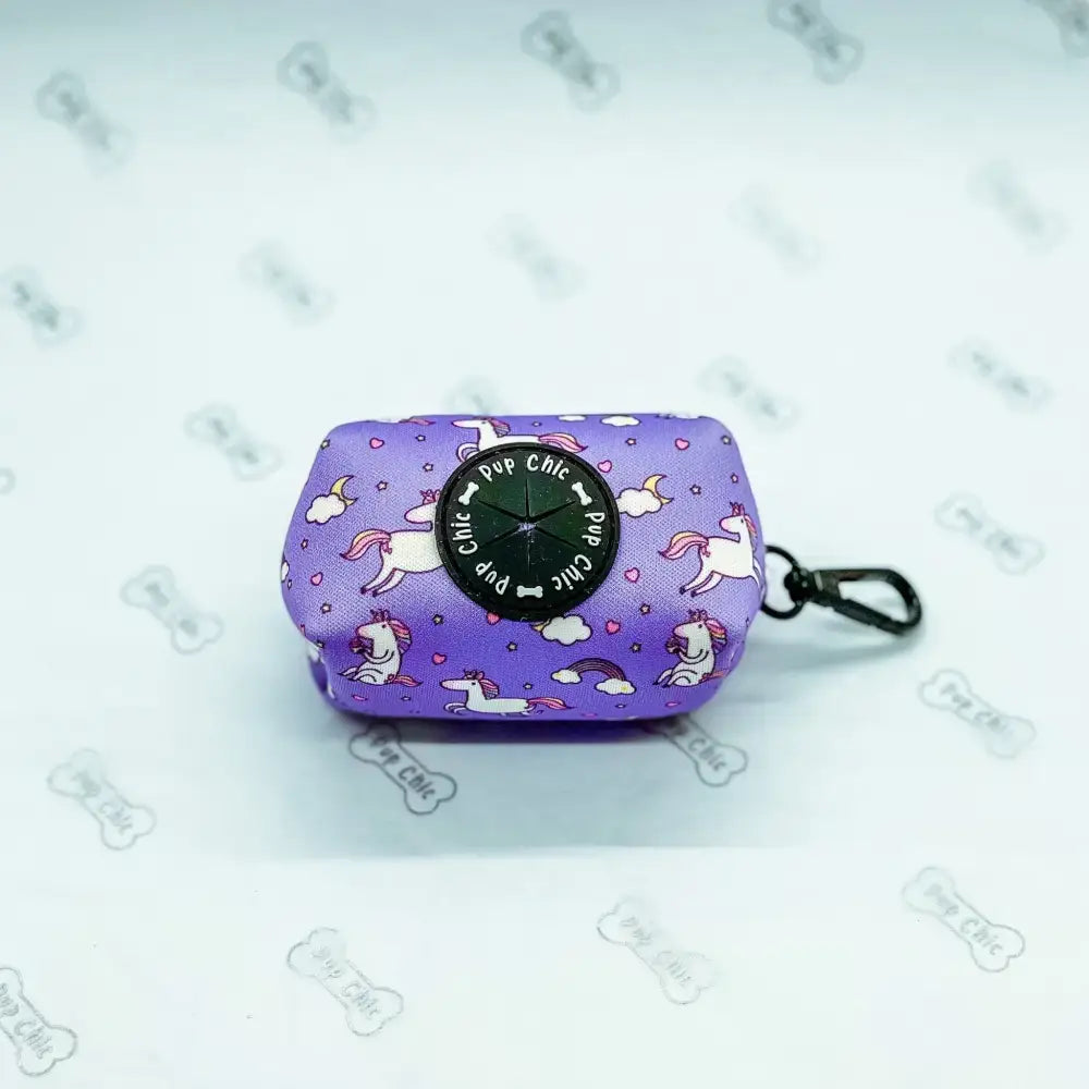 Purple unicorns poo bag holder with black circular top and metal clip perfect as a treat holder for walks