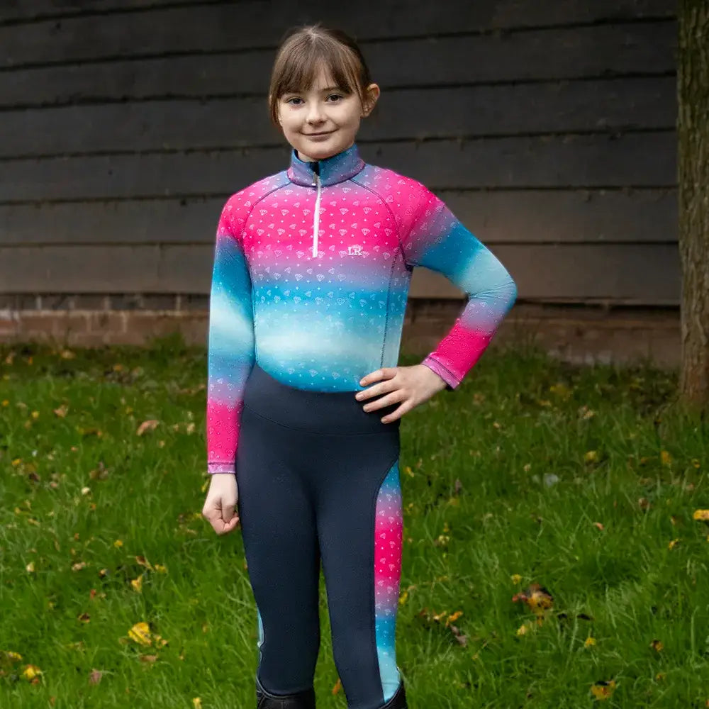 A dazzling diamond base long sleeve equestrian top with ombre pink blue and teal hues by little rider