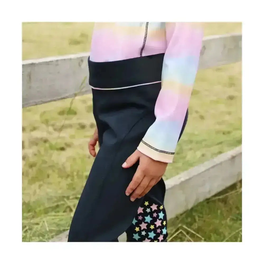 Black dazzling dream riding tights with rainbow gradient sleeve and star patterned navy panel by little rider