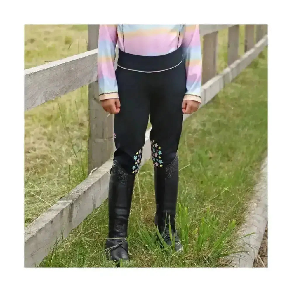 Black dazzling dream riding tights by little rider with star embroidery at cuffs paired with tall black riding boots