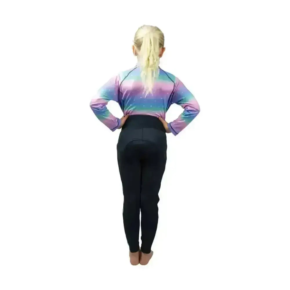 A child wearing the dazzling night base layered funky base layer in iridescent rainbow with flexible fabric
