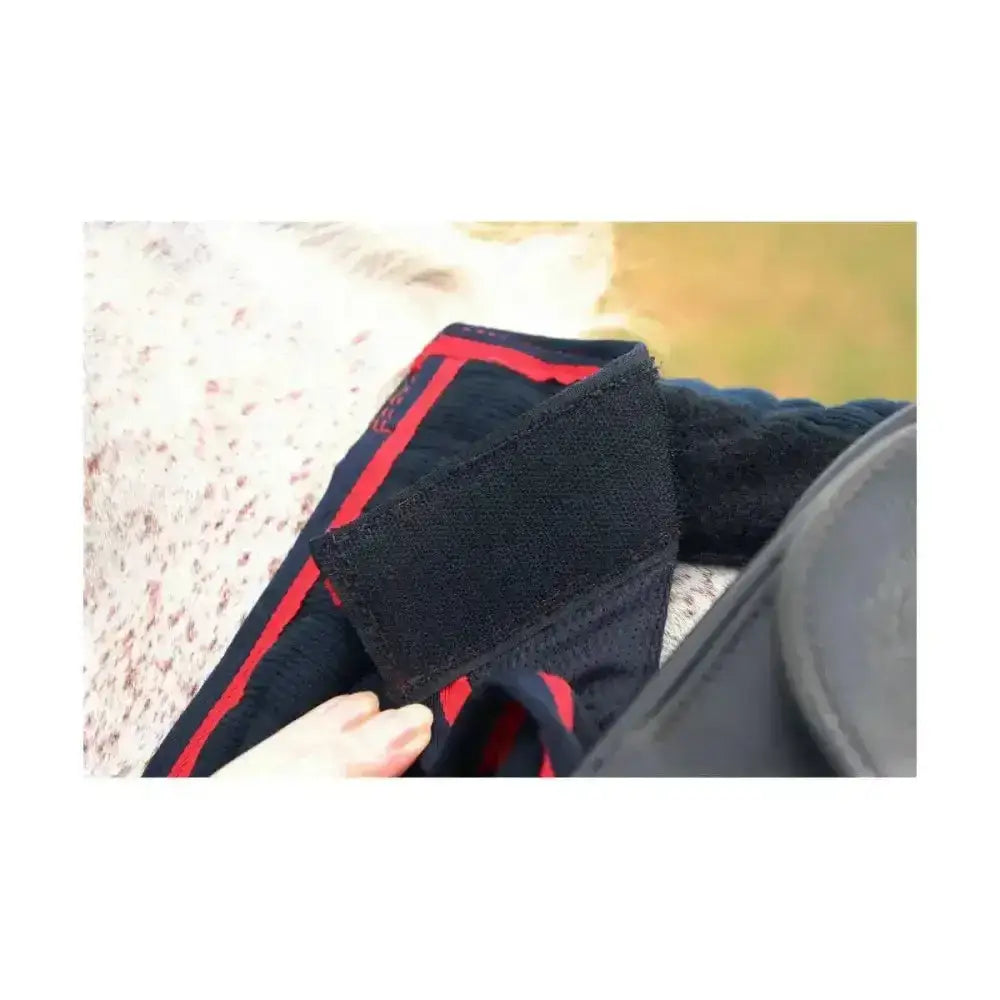 Black athletic compression sleeve with red trim and velcro strap for smart defencex cool control exercise use