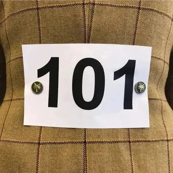 White rectangular room number sign 101 held by equestch foxhead magnetic competition number holders with foxhead fasteners