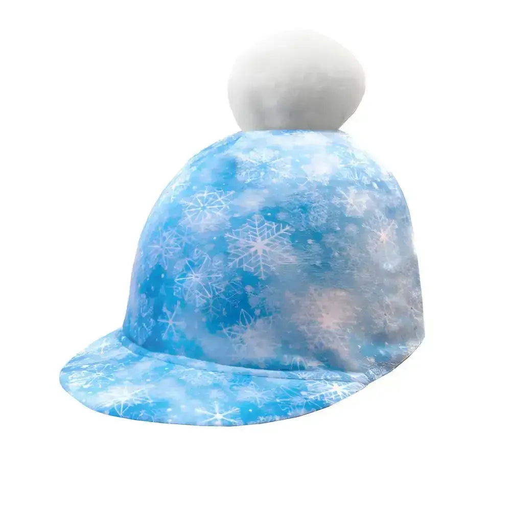 A soft blue equetech childs fjord snowflake hat with white pom pom and icy snowflake pattern for winter wear