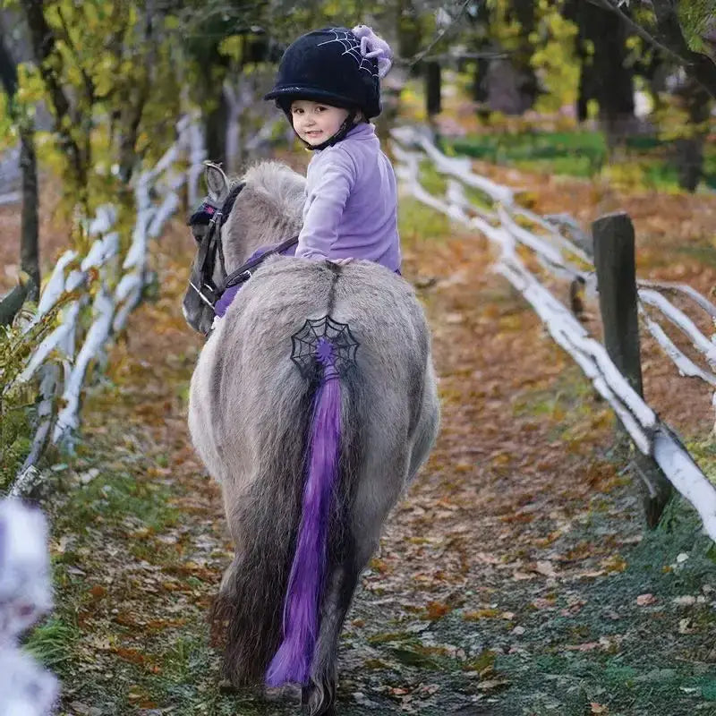 A gray pony with a purple horse tail tassel featuring a black cobweb spider halloween design by equetech cobweb spider