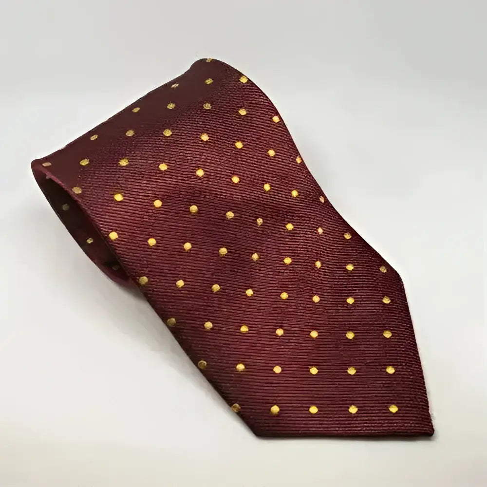 A maroon silk equetech junior polka dot tie with subtle gold dots perfect for junior polka dot ties fans