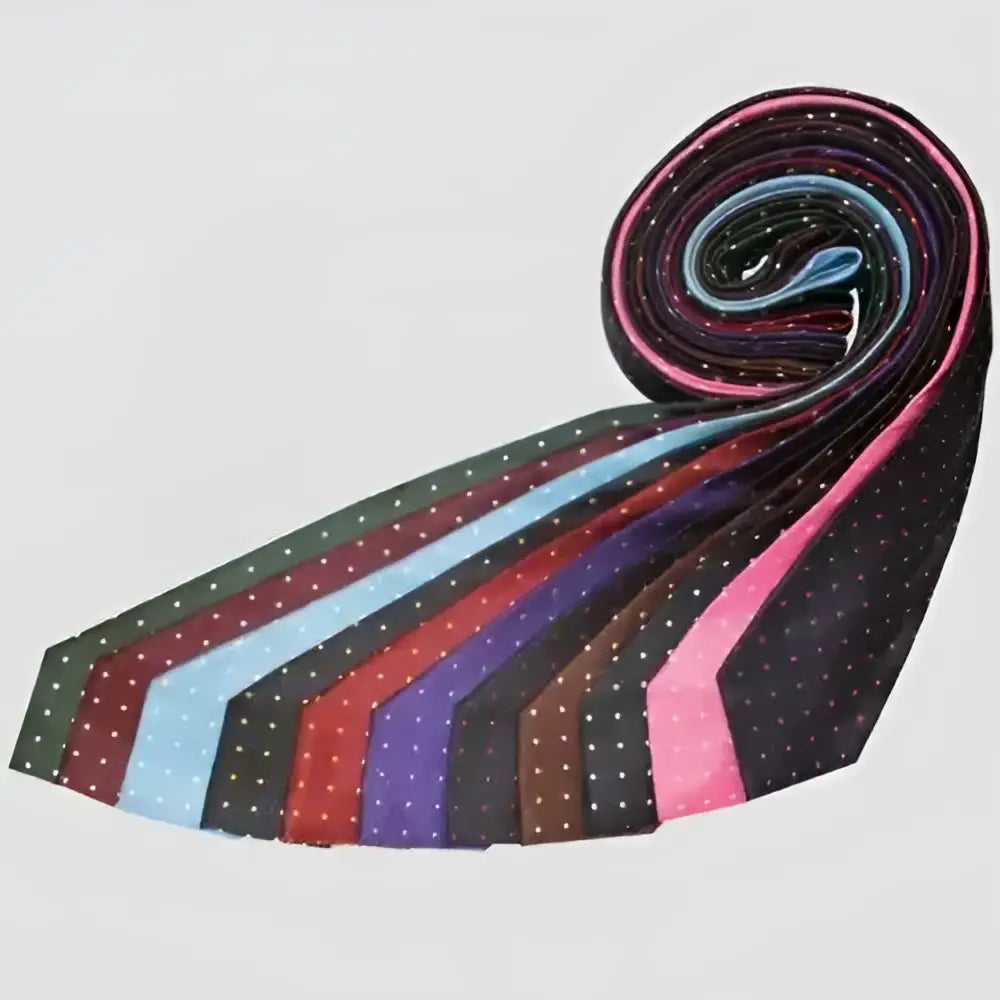 A rolled display of colorful equetech junior polka dot ties in black pink blue red and purple hues