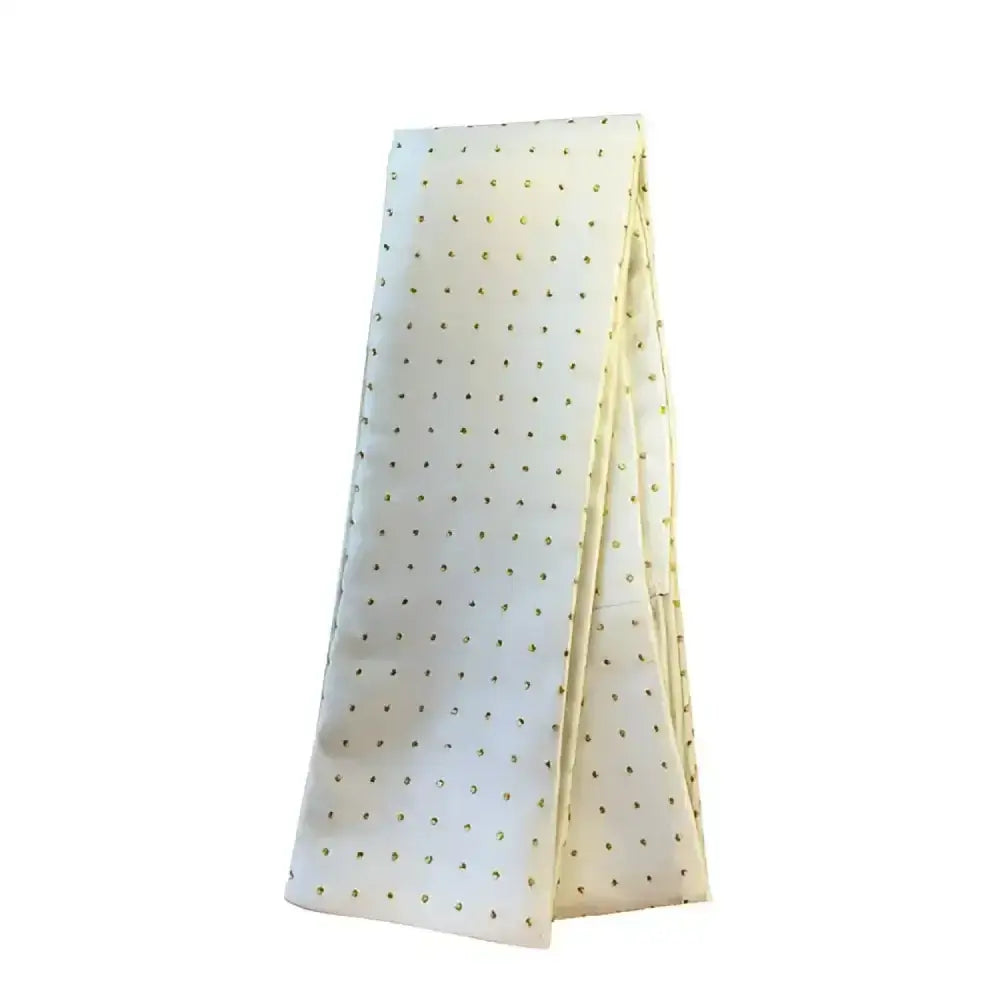 A cream equetech pin spot riding stock with delicate dark metallic gold dots perfect for riding shows