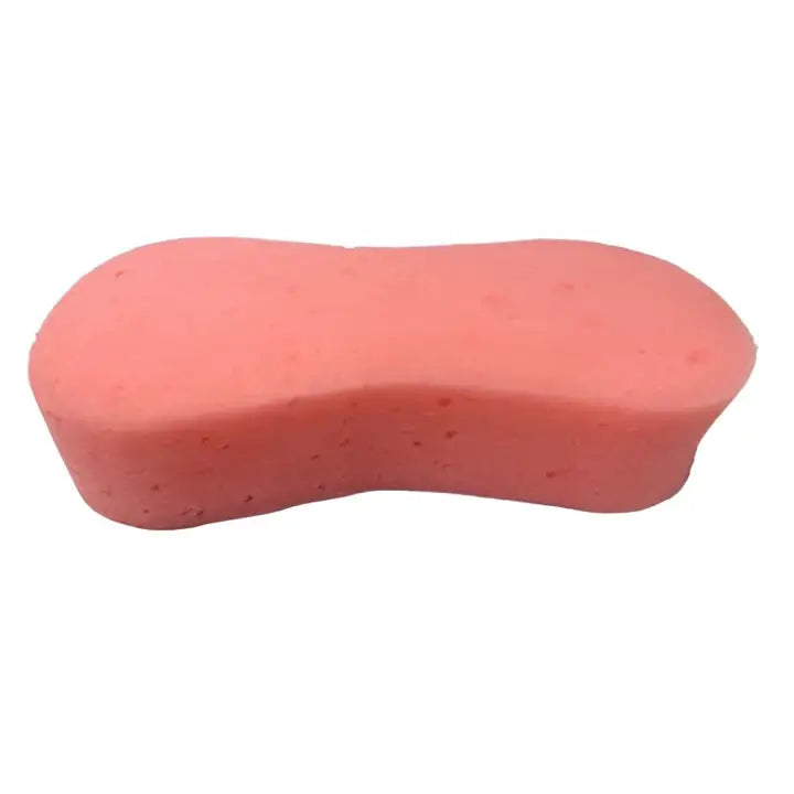 Pink oval-shaped equi-sential expanding sponge with soft porous texture for grooming horses in equestrian care