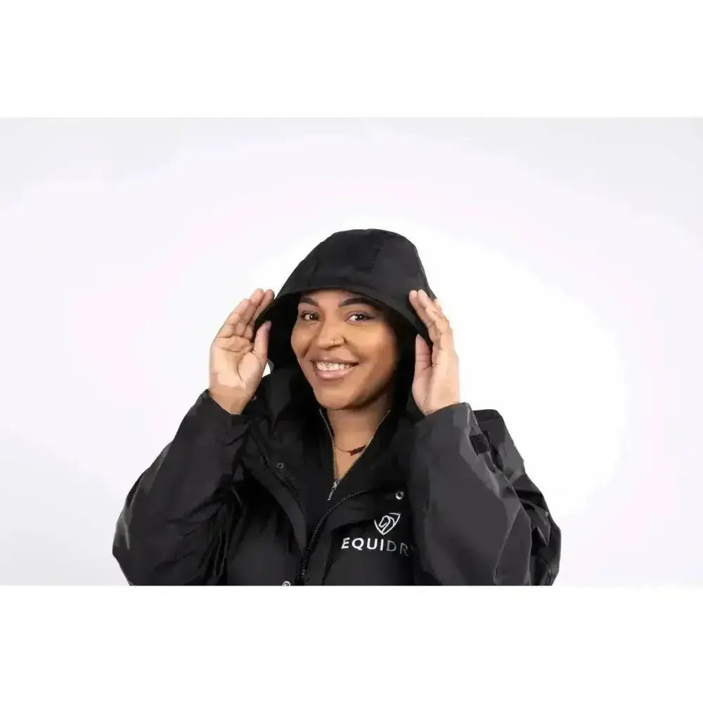 Black equidry equimac waterproof riding jacket with hood mesh lining taped seams and subtle chest logo