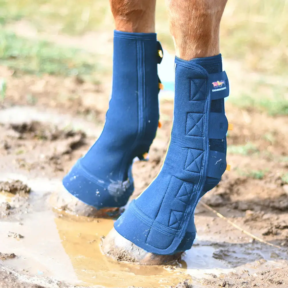 Blue quilted close contact chaps with velcro straps and red bull logo for mud fever prevention equilibrium equi-chaps close