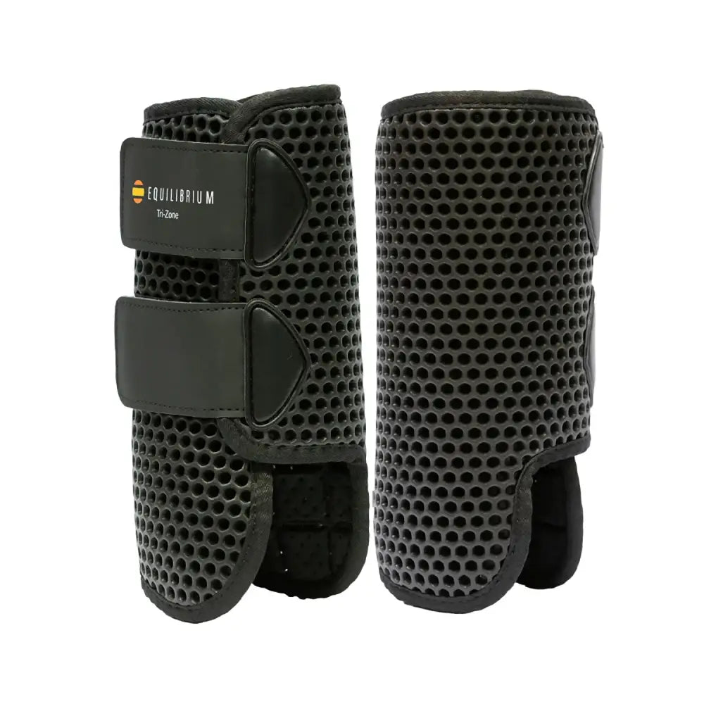 Black equilibrium tri-zone horse leg guards with perforated mesh and adjustable velcro straps perfect all-rounder boots