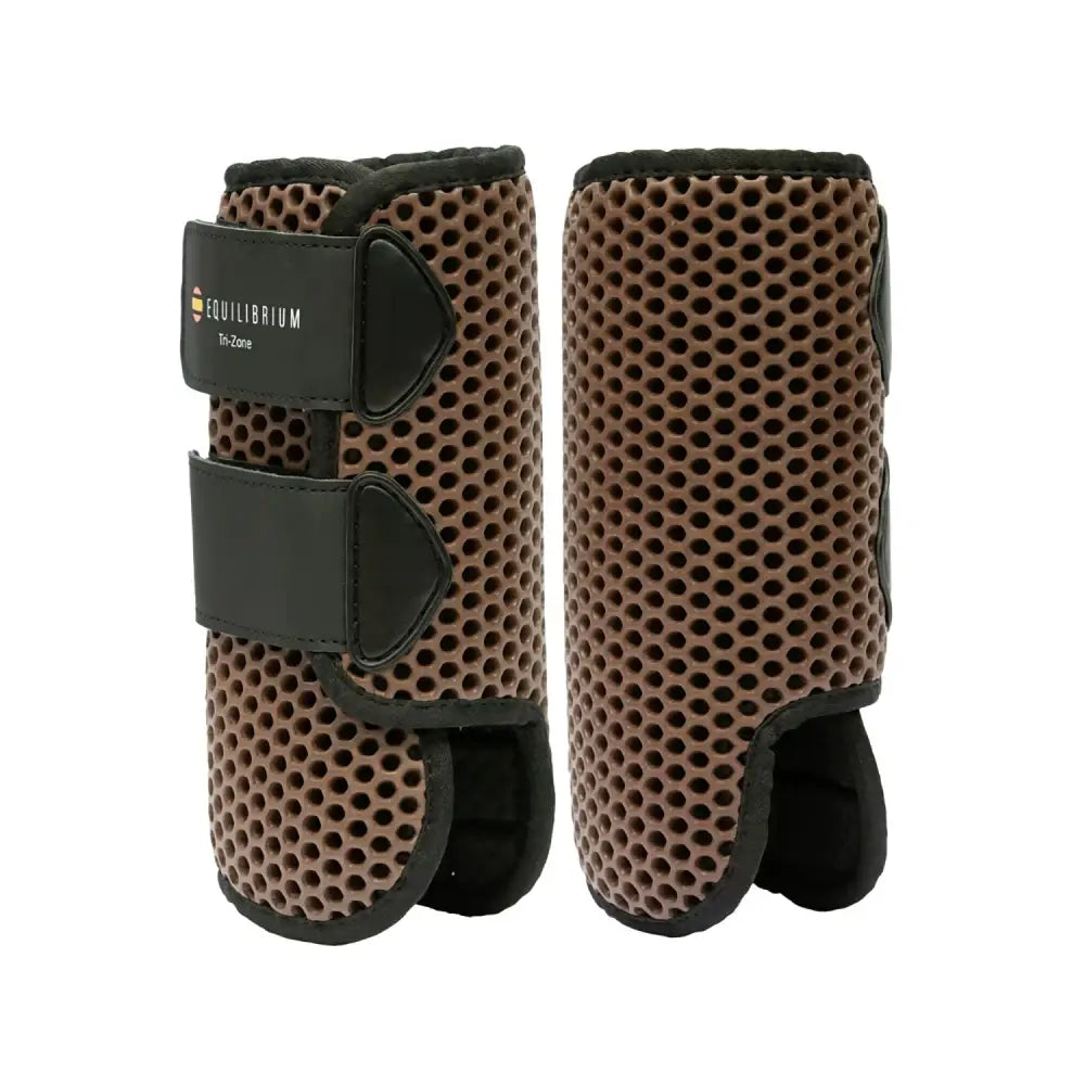 Brown perforated equilibrium tri-zone horse leg guards with black adjustable straps versatile boots perfect all-rounder