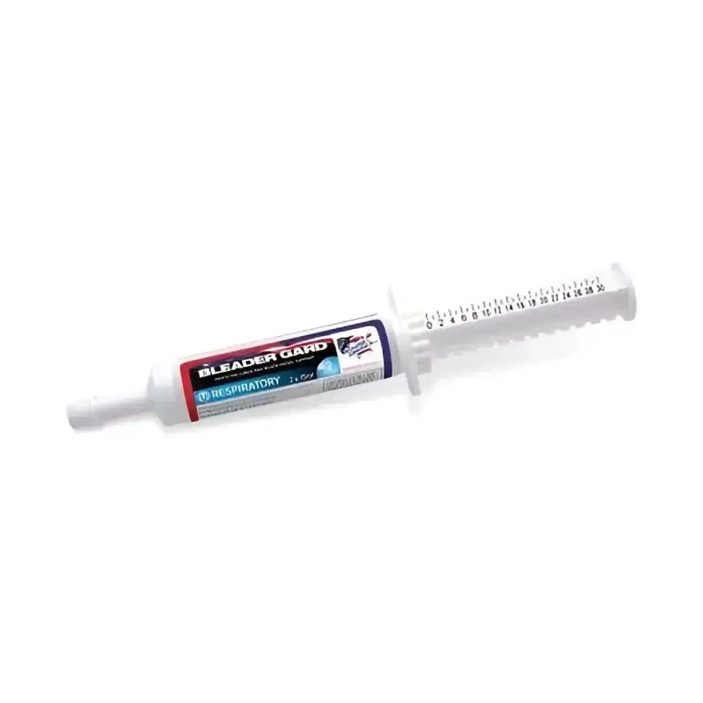 White plastic syringe with red and blue label of equine america bleader gard xxxtreme paste 30ml and measurement markings