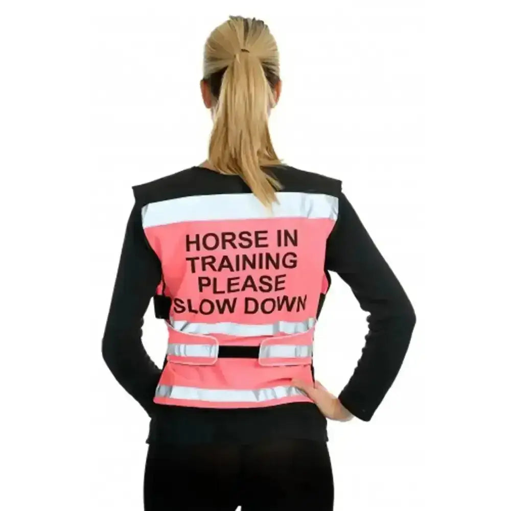 Pink reflective equisafety hi-vis waistcoat with black horse in training text and white stripes for safety and comfort