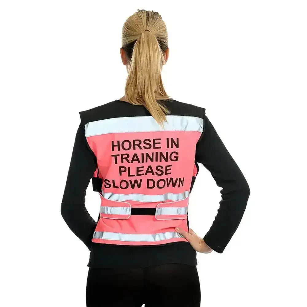 Pink reflective equisafety hi-vis waistcoat with black horse in training text and silver stripes for safety
