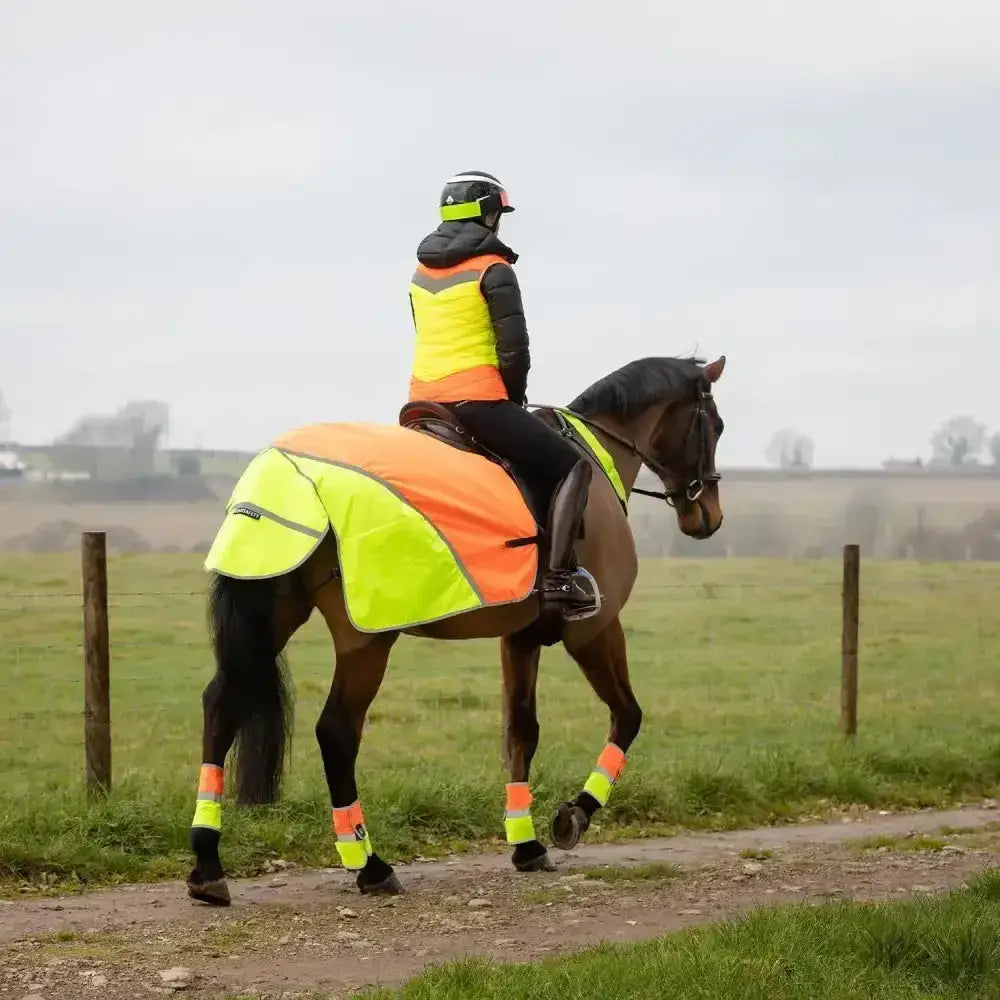 Equisafety hi-vis waterproof quarter sheet in bright neon yellow and orange with black trim for visibility on rides