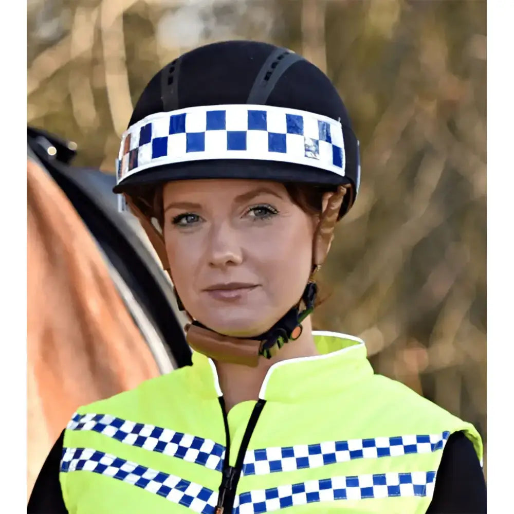 Black police helmet with a blue and white checkered equisafety polite hat band reflective hat band visible