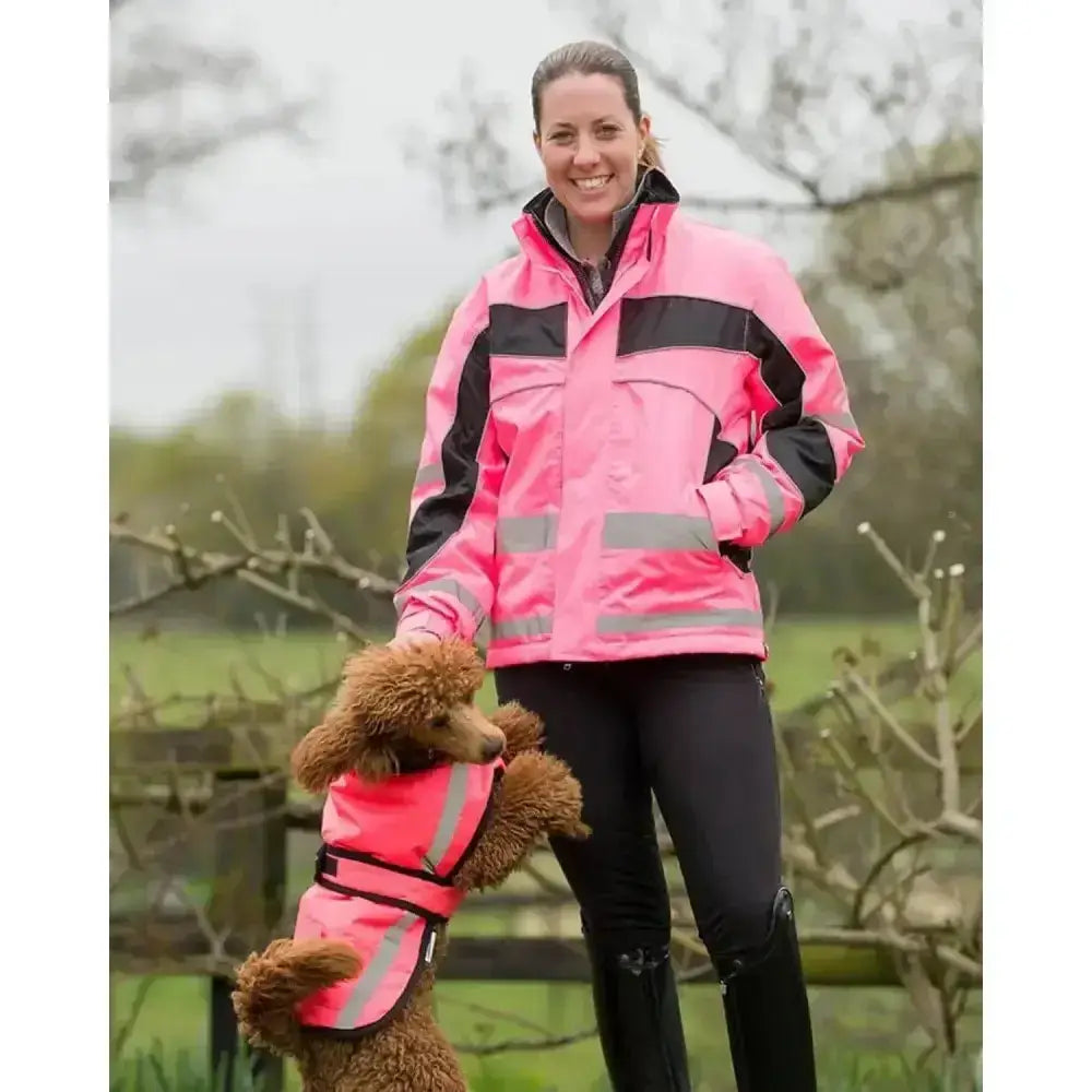 Pink high-visibility dog vest with black trim and reflective stripes from equisafety winter inverno reflective jacket line