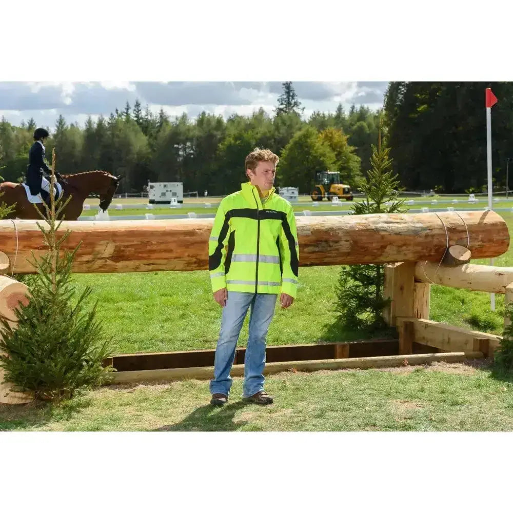 A bright neon green and black equisafety winter inverno reflective hi viz riding jacket with reflective stripes