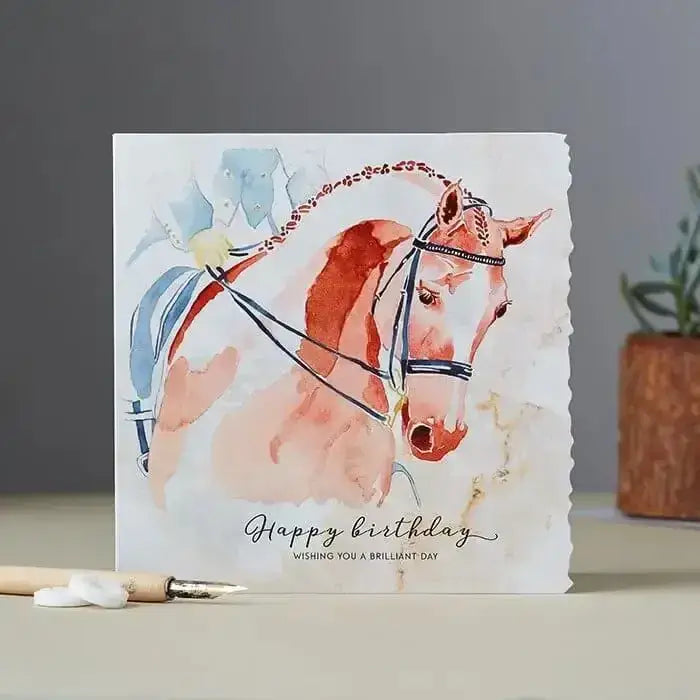Fanciful dolomite card with an orange white horse and decorative bridle for a happy birthday dressage horse greeting