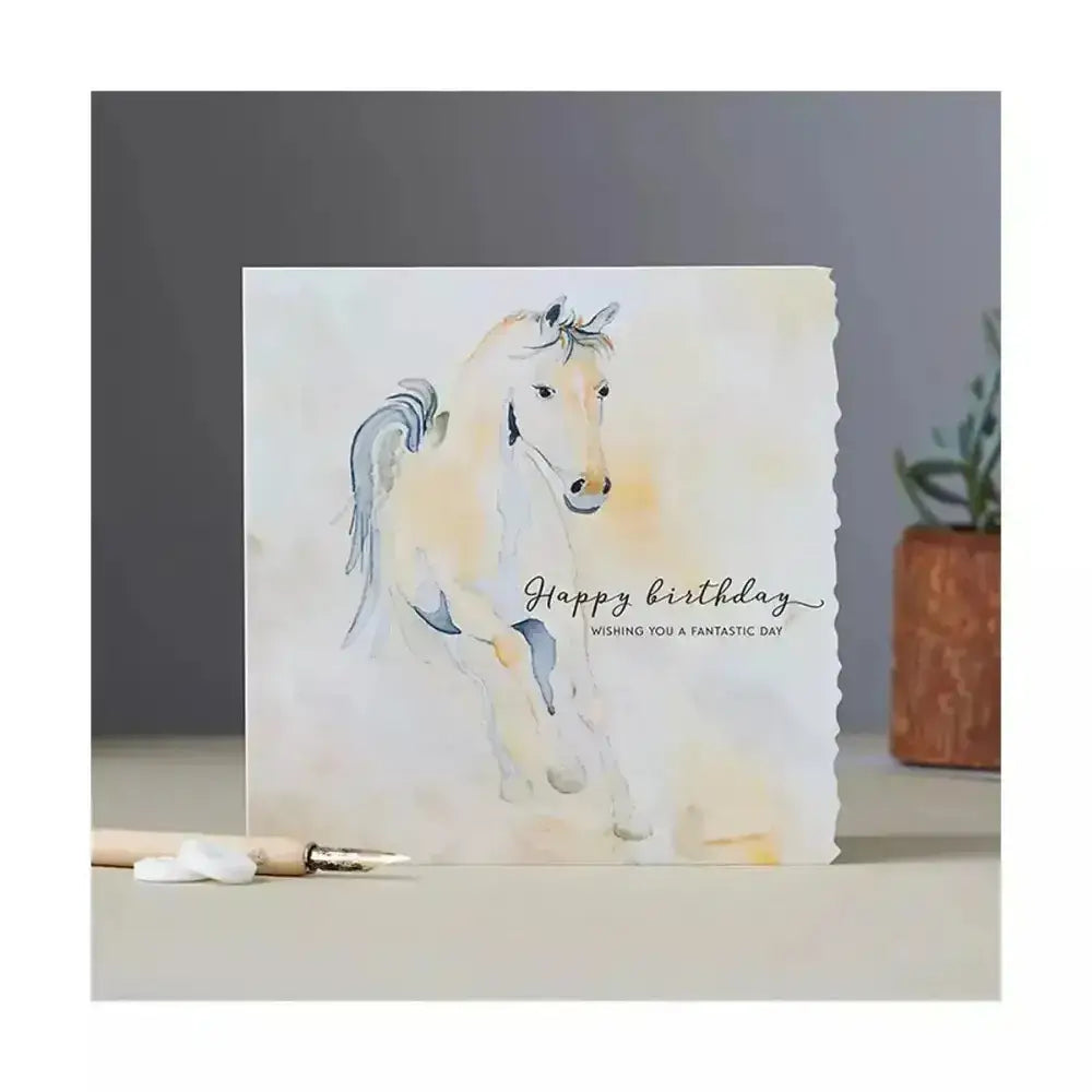 Fanciful dolomite card happy birthday with white horse in blue and yellow on textured paper individually cello wrapped with outer gloss varnish