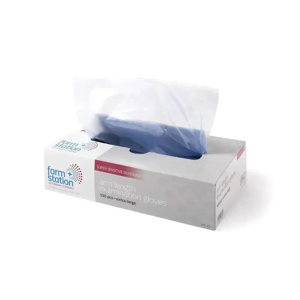A box of farm station silktouch disposable arm-length latex gloves in red and white packaging with blue gloves inside